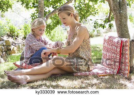 Side profile of mother and a little girl at front or back yard View Large Photo Image Stock Photo - Side profile of mother and a little girl at front or back yard. Fotosearch