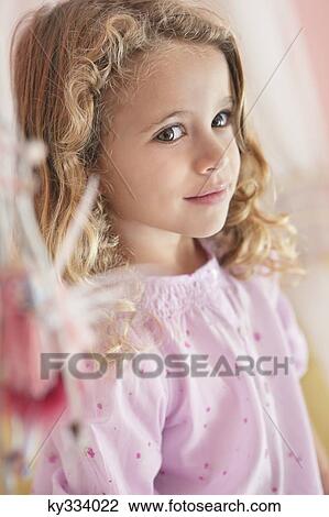 Close-up of a cute little girl View Large Photo Image Stock Image - Close-up of a cute little girl. Fotosearch