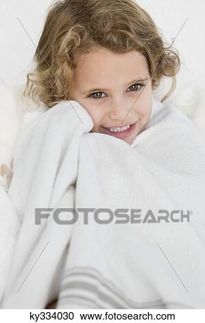 Cute little girl wrapped in a white towel View Large Photo Image Stock Image - Cute little girl wrapped in a white towel. Fotosearch