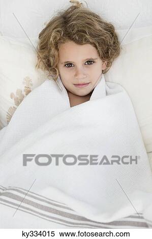 Portrait of a cute little girl wrapped in a white towel View Large Photo Image Stock Photography - Portrait of a cute little girl wrapped in a white towel. Fotosearch