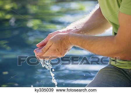 Mature man touching the water of the swimming pool View Large Photo Image Stock Photo - Mature man touching the water of the swimming pool. Fotosearch