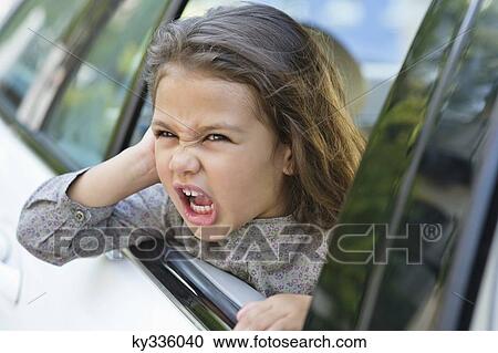 Cute little girl looking out of the car window View Large Photo Image Stock Image - Cute little girl looking out of the car window. Fotosearch