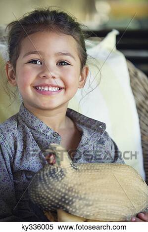 Portrait of a little girl holding model of turkey View Large Photo Image Stock Photography - Portrait of a little girl holding model of turkey. Fotosearch