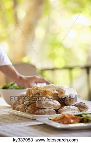 Bread and salad served on a table View Large Photo Image Stock Image - Bread and salad served on a table. Fotosearch