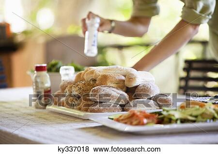 Bread and salad served on a table View Large Photo Image Stock Photo - Bread and salad served on a table. Fotosearch