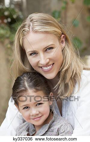 Cheerful mother and daughter View Large Photo Image Stock Photograph - Cheerful mother and daughter . Fotosearch