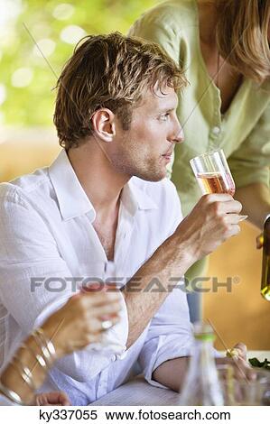 Stock Photography - Family having drinks. Fotosearch