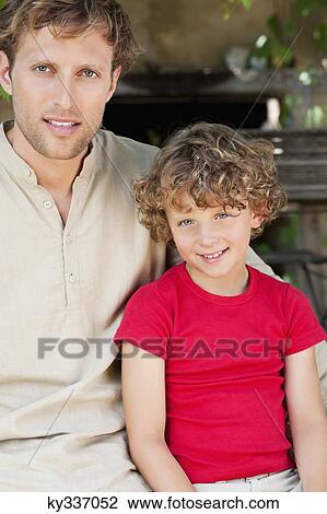 Portrait of a father and son with smiling View Large Photo Image Stock Image - Portrait of a father and son with smiling. Fotosearch