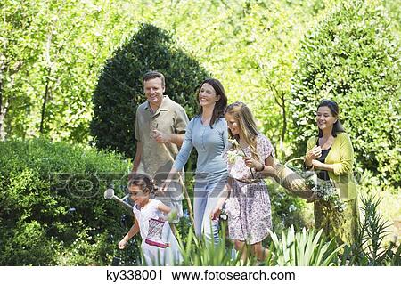Happy multi generation family enjoying in the garden View Large Photo Image Stock Image - Happy multi generation family enjoying in the garden. Fotosearch