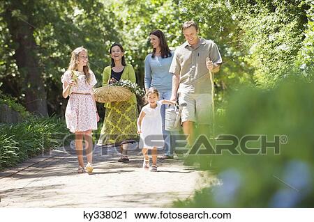 Happy multi generation family enjoying in the garden View Large Photo Image Stock Image - Happy multi generation family enjoying in the garden. Fotosearch