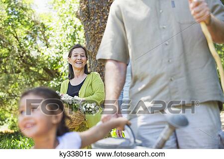 Stock Photography - Happy multi generation family enjoying in the garden. Fotosearch