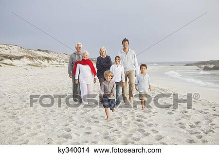 Family enjoying on the beach View Large Photo Image Picture - Family enjoying on the beach. Fotosearch