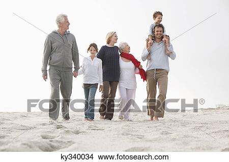 Family enjoying on the beach View Large Photo Image Picture - Family enjoying on the beach. Fotosearch
