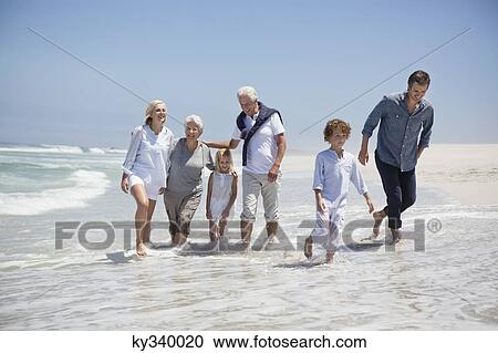 Family enjoying on the beach View Large Photo Image Stock Image - Family enjoying on the beach. Fotosearch