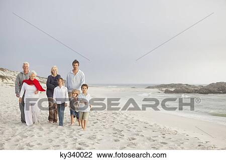Family enjoying on the beach View Large Photo Image Stock Image - Family enjoying on the beach. Fotosearch