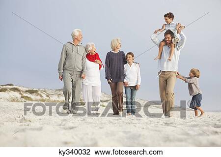 Family enjoying on the beach View Large Photo Image Stock Image - Family enjoying on the beach. Fotosearch