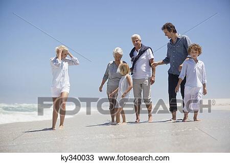 Family enjoying on the beach View Large Photo Image Stock Image - Family enjoying on the beach. Fotosearch