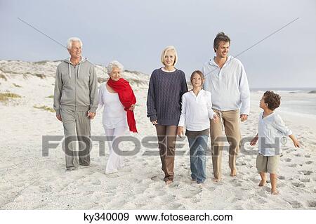Family enjoying on the beach View Large Photo Image Stock Photo - Family enjoying on the beach. Fotosearch