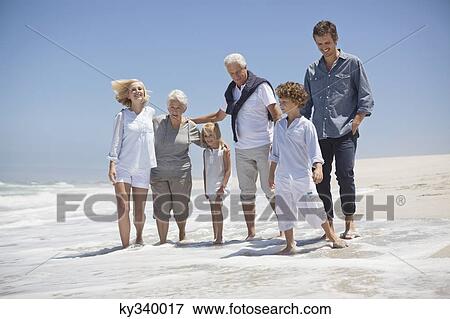 Family enjoying on the beach View Large Photo Image Stock Photo - Family enjoying on the beach. Fotosearch