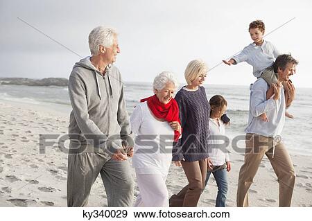 Family enjoying on the beach View Large Photo Image Stock Photo - Family enjoying on the beach. Fotosearch