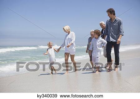 Family enjoying on the beach View Large Photo Image Stock Photo - Family enjoying on the beach. Fotosearch