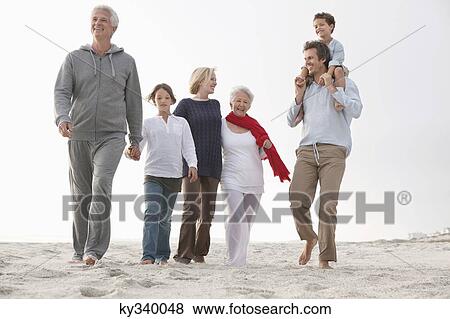 Family enjoying on the beach View Large Photo Image Stock Photo - Family enjoying on the beach. Fotosearch