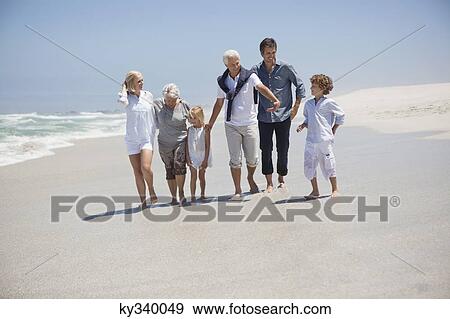 Family enjoying on the beach View Large Photo Image Stock Photo - Family enjoying on the beach. Fotosearch