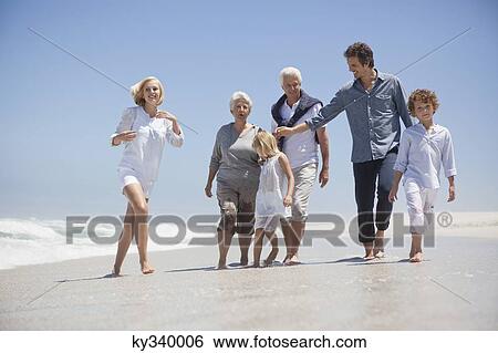 Family enjoying on the beach View Large Photo Image Stock Photograph - Family enjoying on the beach. Fotosearch