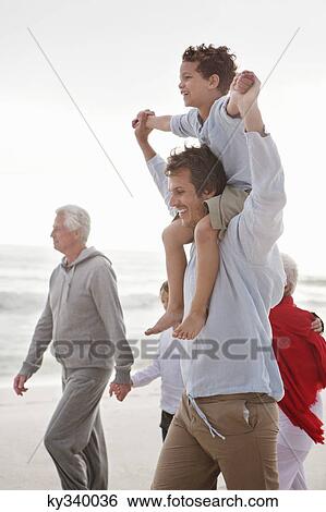 Family enjoying on the beach View Large Photo Image Stock Photograph - Family enjoying on the beach. Fotosearch