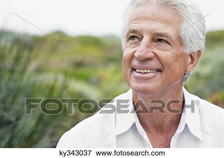 Close-up of a senior man smiling View Large Photo Image Stock Photo - Close-up of a senior man smiling. Fotosearch
