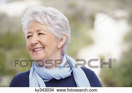Close-up of a senior woman smiling View Large Photo Image Picture - Close-up of a senior woman smiling. Fotosearch