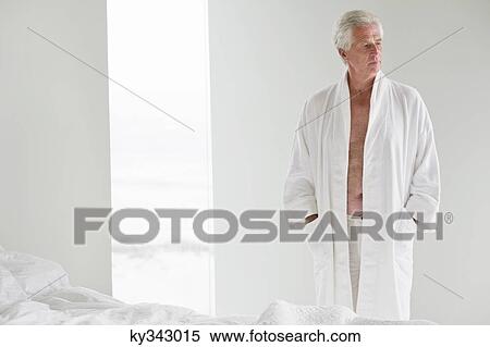 Senior man wearing a bathrobe View Large Photo Image Stock Photography - Senior man wearing a bathrobe. Fotosearch