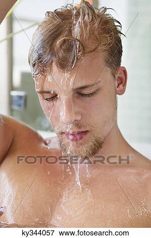 Close-up of a man taking bath View Large Photo Image Stock Photo - Close-up of a man taking bath. Fotosearch