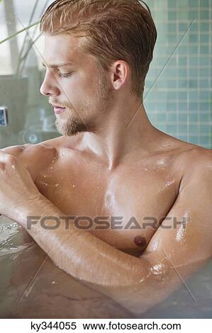 Close-up of a man taking bath View Large Photo Image Stock Photography - Close-up of a man taking bath. Fotosearch