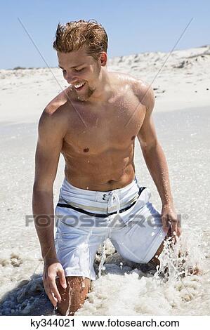 Man enjoying on a beach View Large Photo Image Stock Image - Man enjoying on a beach. Fotosearch