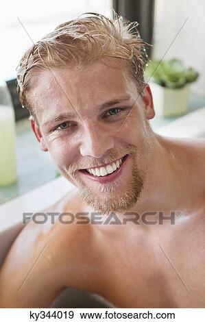 Portrait of a man smiling in a bathtub View Large Photo Image Stock Photo - Portrait of a man smiling in a bathtub. Fotosearch