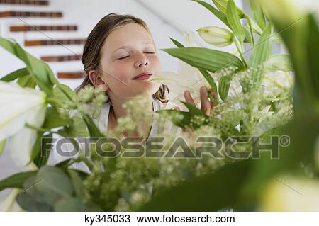 Cute girl smelling the fragrance of leaves View Large Photo Image Stock Image - Cute girl smelling the fragrance of leaves. Fotosearch