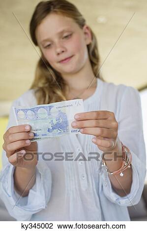 Girl holding money View Large Photo Image Stock Image - Girl holding money. Fotosearch
