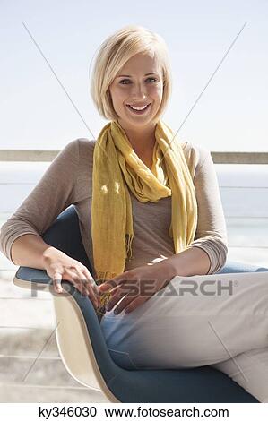 Stock Image - Portrait of a beautiful woman smiling. Fotosearch