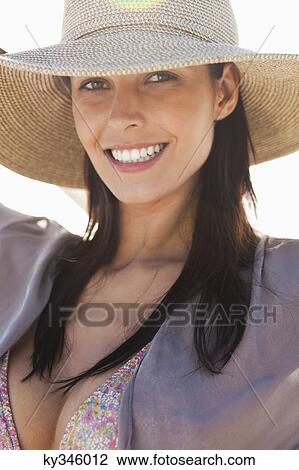 Portrait of a woman wearing sun hat and smiling View Large Photo Image Stock Image - Portrait of a woman wearing sun hat and smiling. Fotosearch