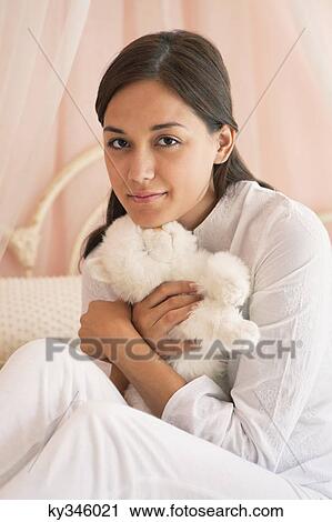 Woman hugging a teddy bear View Large Photo Image Stock Image - Woman hugging a teddy bear. Fotosearch