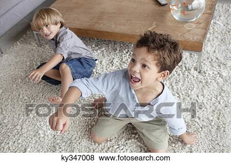 Stock Photo - Boys playing in home. Fotosearch