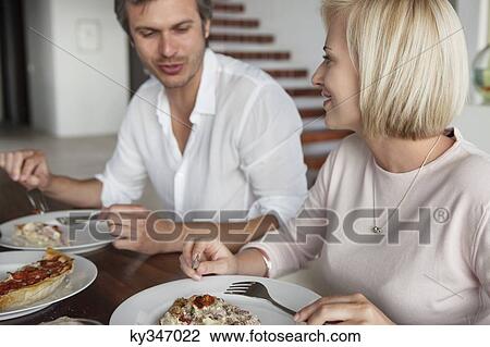 Stock Image - Couple having food. Fotosearch
