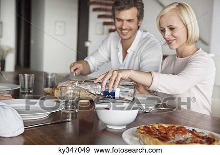 Stock Photo - Couple having food. Fotosearch