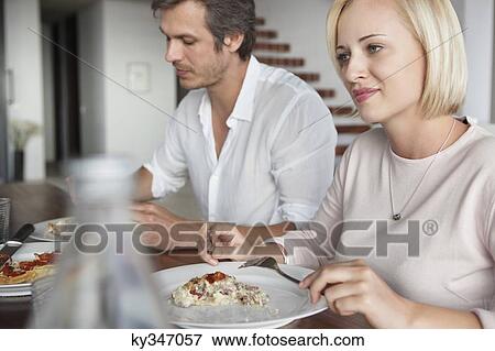 Stock Photo - Couple having food. Fotosearch
