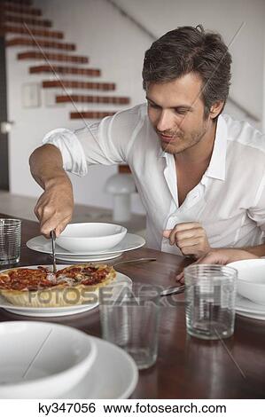Man having food View Large Photo Image Stock Photograph - Man having food. Fotosearch