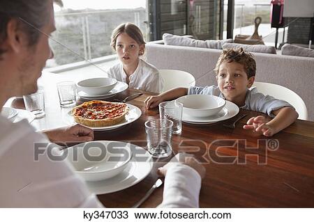 Man talking to children during meal time View Large Photo Image Stock Image - Man talking to children during meal time. Fotosearch