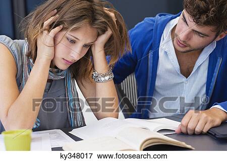 University student consoling his friend in a classroom View Large Photo Image Stock Photo - University student consoling his friend in a classroom. Fotosearch