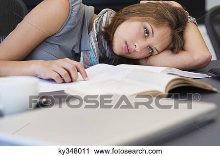 University student looking tired while studying View Large Photo Image Stock Image - University student looking tired while studying. Fotosearch