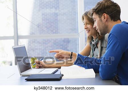 University students using laptop in classroom View Large Photo Image Stock Image - University students using laptop in classroom. Fotosearch
